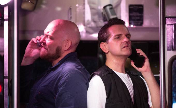 Two actors performing in the Speed: The Movie, The Play performance